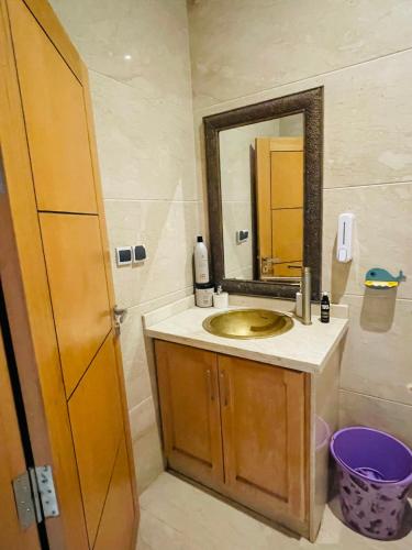 a bathroom with a sink and a mirror at Entire Villa Garden Wi-Fi Near Beach in Agadir