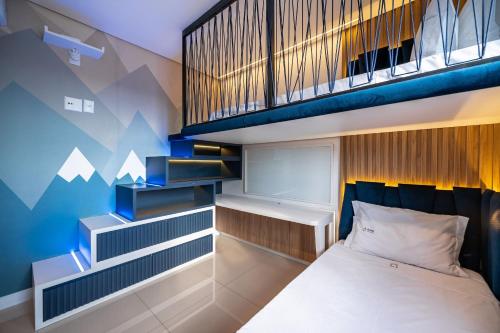 Ένα ή περισσότερα κρεβάτια σε δωμάτιο στο Blue Life 3 Suítes com Academia by Achei Camboriú