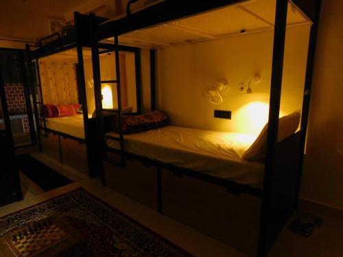 Postel nebo postele na pokoji v ubytování CAMP24x7