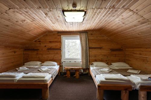Postel nebo postele na pokoji v ubytování Alpin Eco Chalet & Wellness