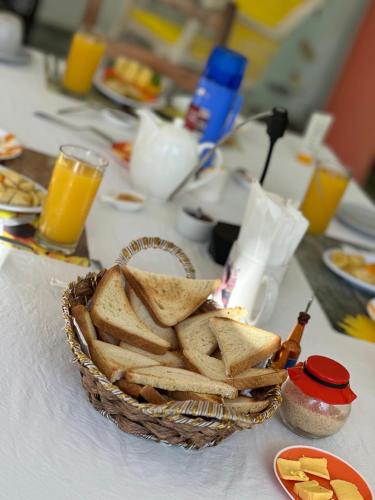 a basket of bread sitting on top of a table at Casa Mariana in Las Terrenas