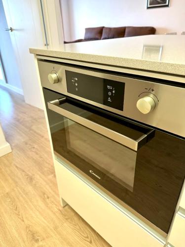 a microwave oven sitting in a drawer in a kitchen at Horizonte 3 Charming apartment with breathtaking sea view at first line of Fuengirola beach in Fuengirola