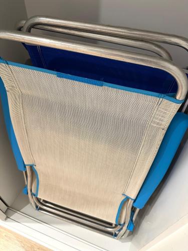 an open suitcase with blue handles in a vehicle at Horizonte 3 Charming apartment with breathtaking sea view at first line of Fuengirola beach in Fuengirola
