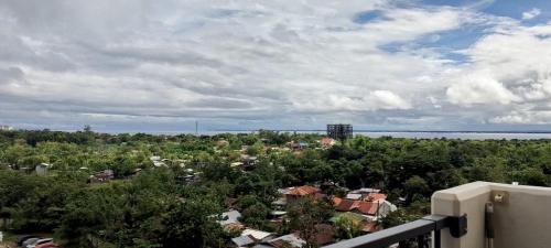 an aerial view of a city with trees and water at Luxury Condo-Sea View- Near Beach in Lapu Lapu City