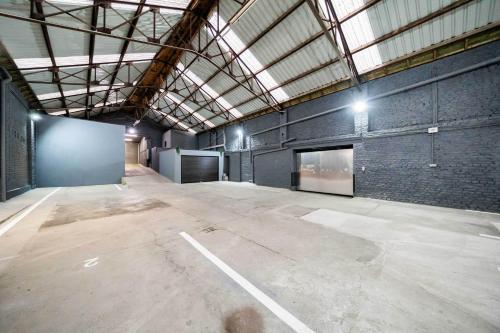 a large empty room with a brick wall at Loft36 in Herstal