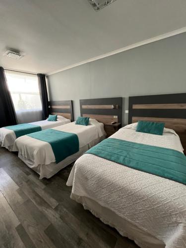 Postel nebo postele na pokoji v ubytování Hotel Real