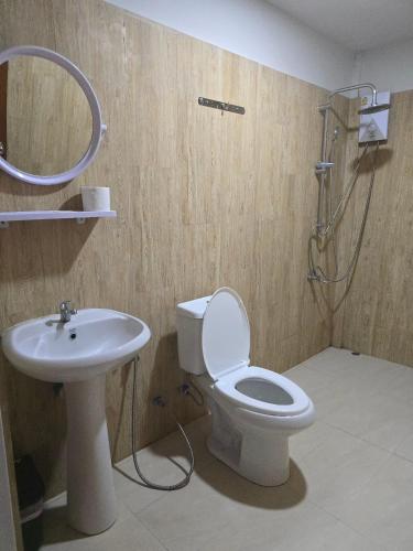 a bathroom with a toilet and a sink at Ao Nang Khao Kaeo Resort in Ao Nang Beach