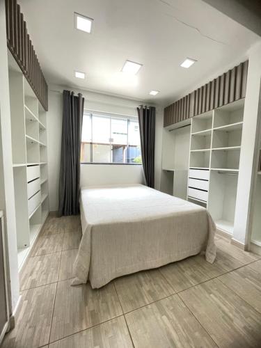 Cama o camas de una habitación en Casa piscina com hidromassagem