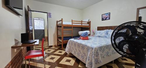 Ένα ή περισσότερα κρεβάτια σε δωμάτιο στο Cida Flats - AP aconchegante a 10 minutos do centro com garagem exclusiva