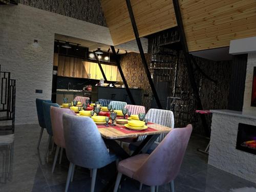 a dining room with a table with bananas on it at Qafqaz Rolling Bungalow HOT POOL in Gabala