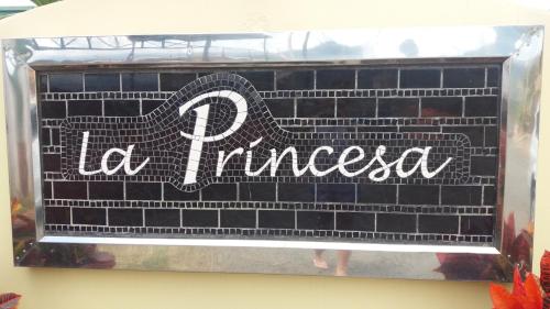 a sign that says la franciscota on a brick wall at La Princesa Hotel in San Isidro