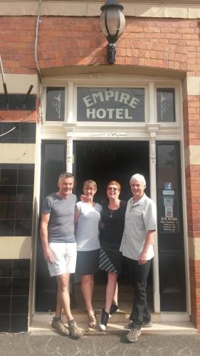 a group of people standing outside of a building at The Empire Hotel Deloraine in Deloraine