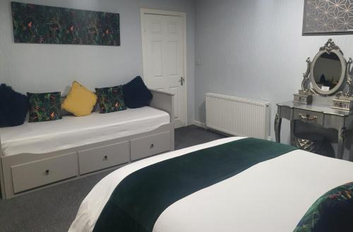 Ένα ή περισσότερα κρεβάτια σε δωμάτιο στο Saphire Glasgow Apartments