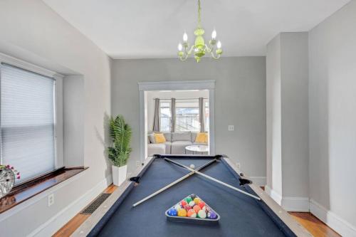 a pool table in a living room with a billiard at 446 Large 3 bedroom with Hot Tub in Lakewood