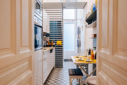 a kitchen with a table and a dining room at Mauthaus Schönbrunn in Vienna