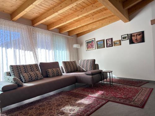 a living room with a couch and a window at Casa Delfina in Grosotto