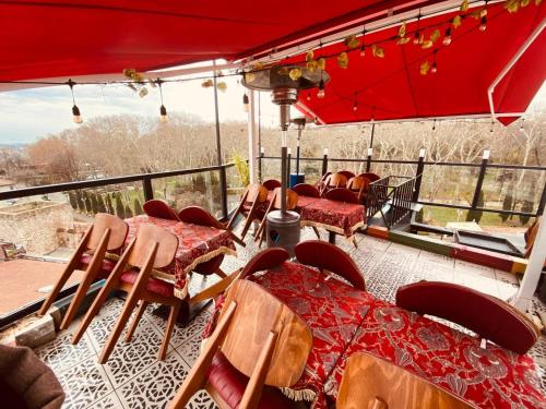 a group of chairs and tables on a balcony at Ottoman Luxury Hotel in Istanbul