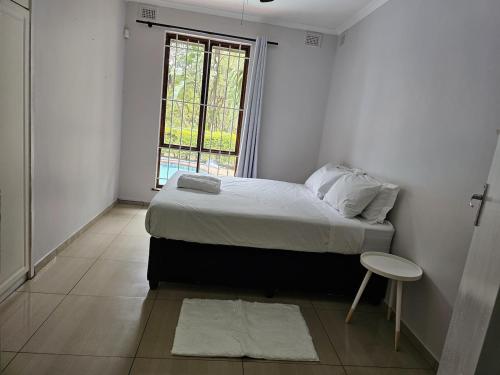 Ένα ή περισσότερα κρεβάτια σε δωμάτιο στο 3 Bedroom house in very secure area