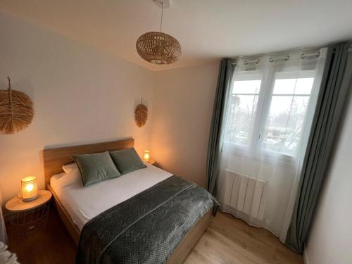 Katil atau katil-katil dalam bilik di Logement familial avec jardin