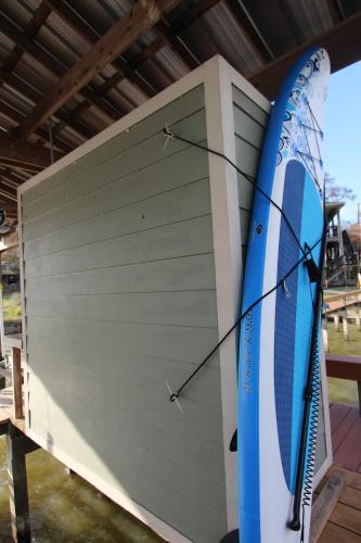 a surfboard is leaning up against a wall at Relaxation on the lake in Livingston