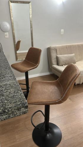 a living room with two chairs and a couch at Allianz Parque Loft Studio in Sao Paulo
