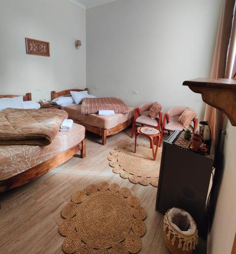 a living room with a bed and a couch at Champollion Palace in Cairo