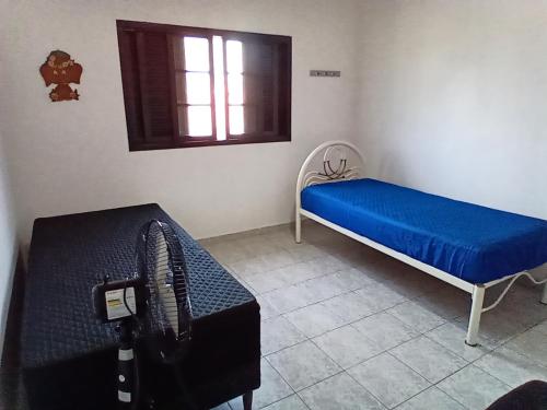 Ένα ή περισσότερα κρεβάτια σε δωμάτιο στο Sobrado no litoral norte de são Sebastião