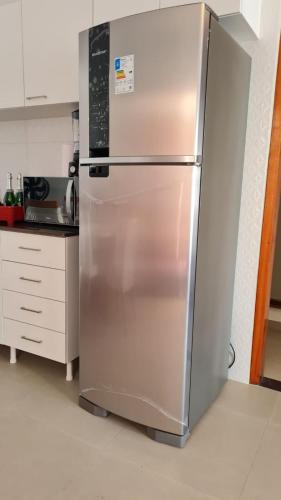 a stainless steel refrigerator in a kitchen at Canoa Breeze - Apartment Roof Top in Canoa Quebrada
