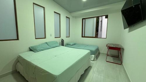 Postel nebo postele na pokoji v ubytování Finca Ecorivera Resort en Rivera-Huila