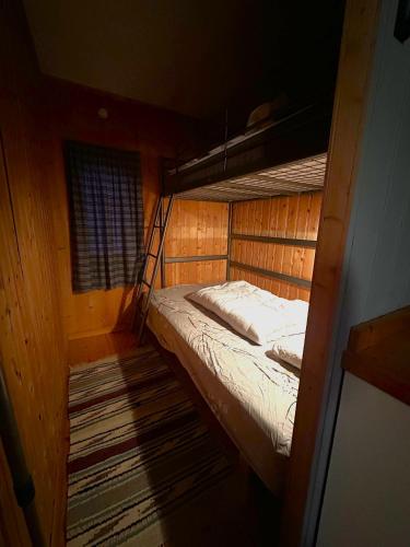 a small room with a bunk bed in a cabin at Turifoss Camping Cabin 1 in Meråker