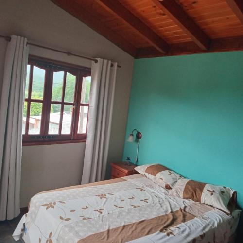 En eller flere senge i et værelse på Mis 4 Soles