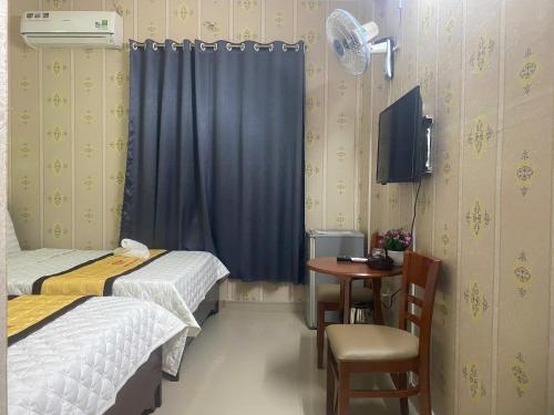 Katil atau katil-katil dalam bilik di Hotel Minh Phát