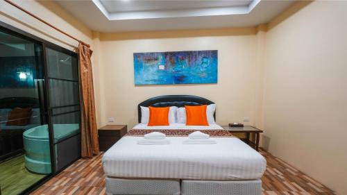 Postel nebo postele na pokoji v ubytování So View Phuket Resort