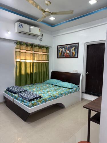 a bedroom with a bed in a room at Mutha's Homestay in Aurangabad