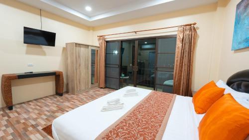 Postel nebo postele na pokoji v ubytování So View Phuket Resort
