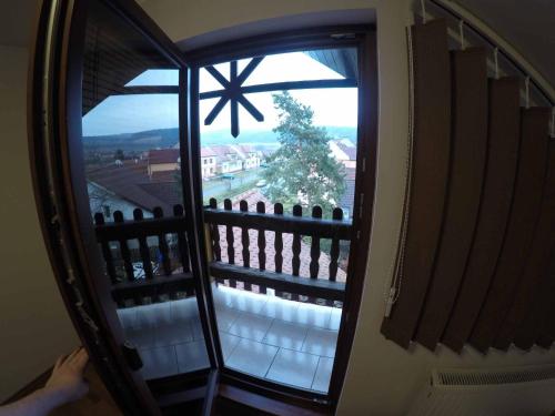 a large window with a view of a balcony at Penzion U Holuba in Hradčovice