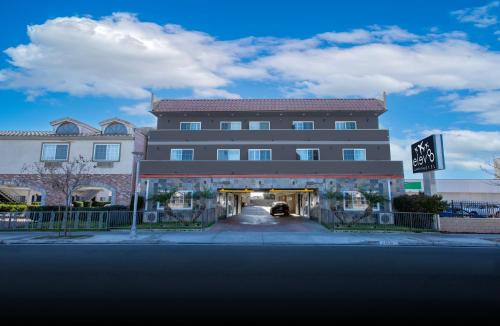 a large building with a sign in front of it at Elev8 Hotel Los Angeles, LAX in Inglewood