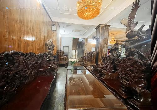 a room with a long table with glasses on it at Trường Ngọc Hotel in Buon Ma Thuot