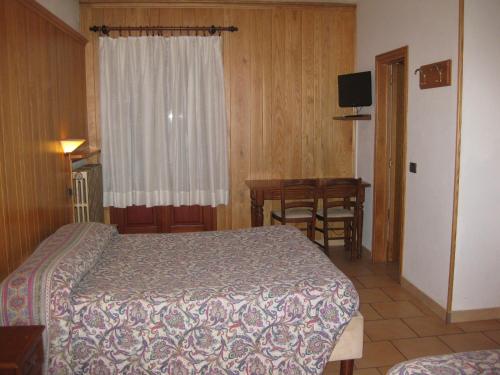 Postel nebo postele na pokoji v ubytování Albergo "da Tosca"