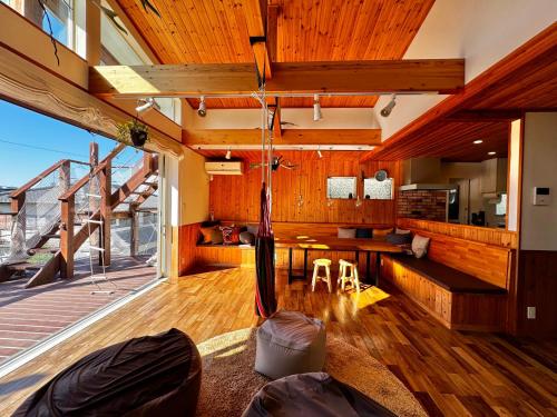 a room with a hammock in the middle of a building at Kamiya Cottage in Hayama