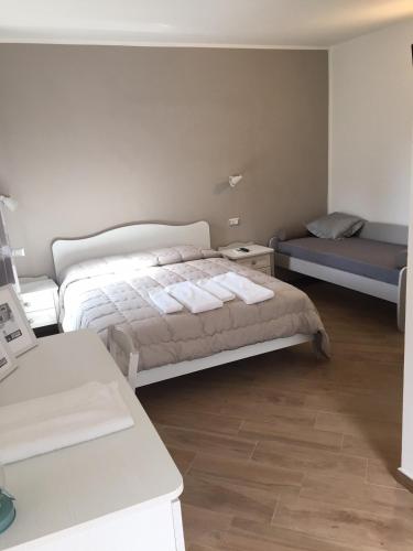 Letto o letti in una camera di Villa Caterina Affittacamere