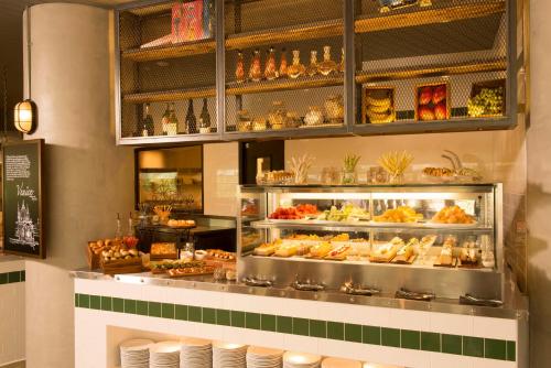 a bakery with a display case filled with food at Just Sleep - Taipei NTU in Taipei