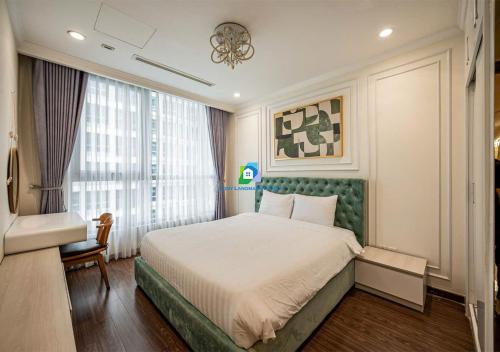 a bedroom with a large bed and a window at the Vinhome Central apartment - The Best Landmark Area in Ho Chi Minh City