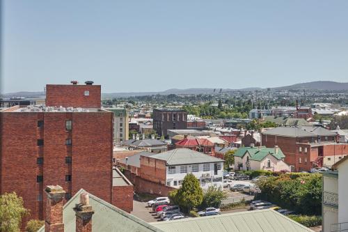 an aerial view of a city with buildings at Balmoral On York in Launceston