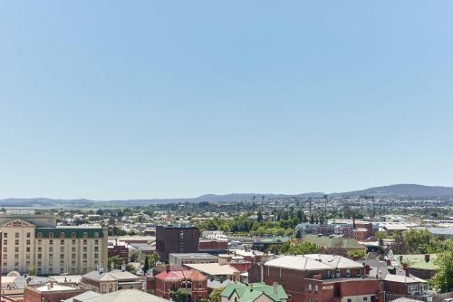 an aerial view of a city with buildings at Balmoral On York in Launceston