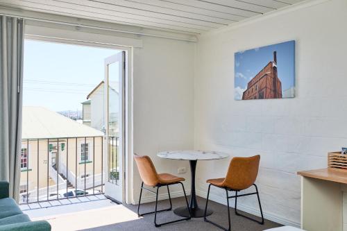 a room with a table and two chairs and a window at Balmoral On York in Launceston