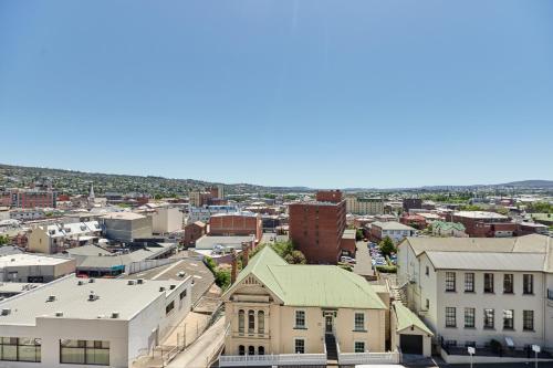 an aerial view of a city with buildings at Balmoral On York in Launceston