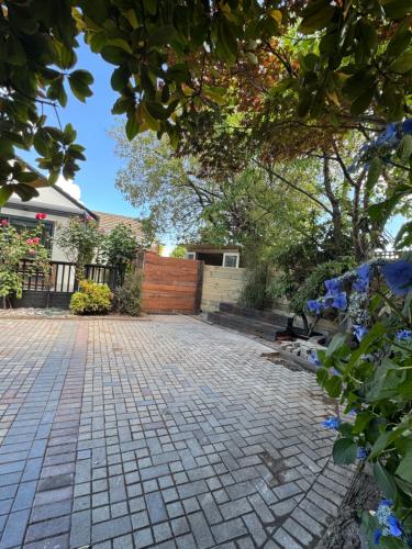 a brick driveway in front of a house at Home in Church corner in Christchurch