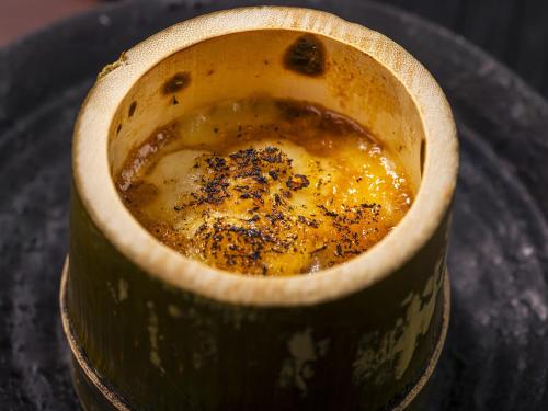 a cup filled with liquid on top of a table at Hanare no yado Kamigakure in Takachiho