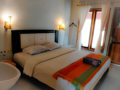 Ένα ή περισσότερα κρεβάτια σε δωμάτιο στο Tania Homestay